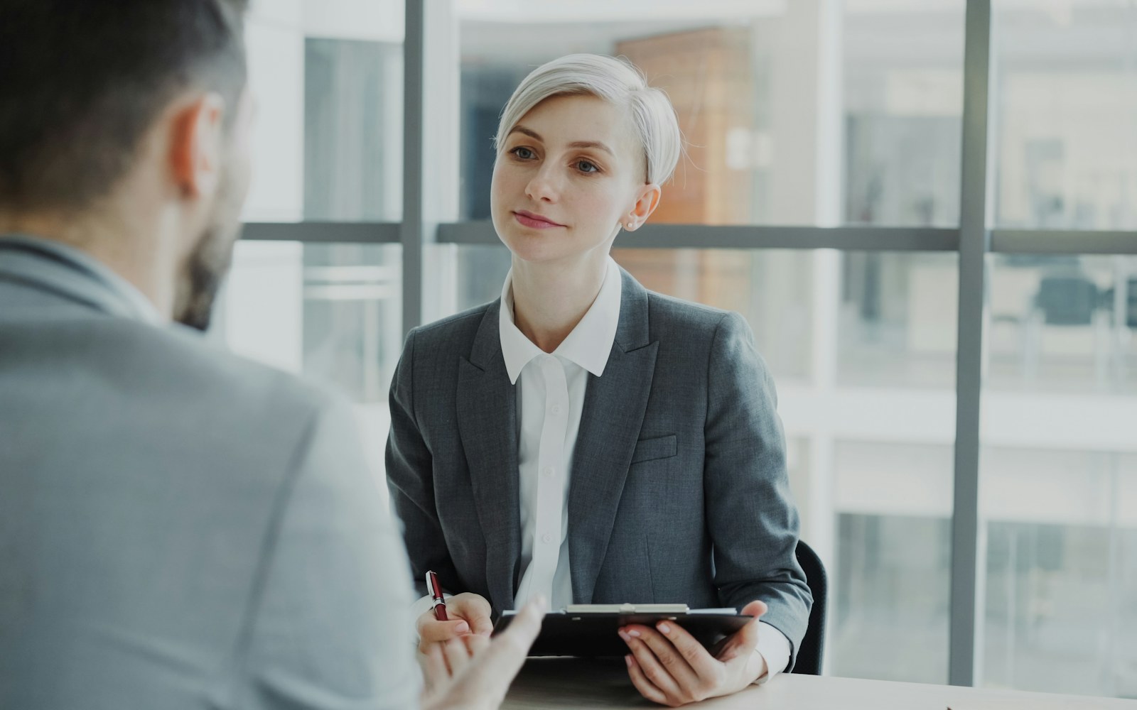 Recruiter conducting a structured interview with a candidate